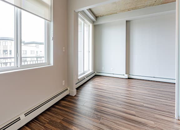 A room with wooden floors and white walls.
