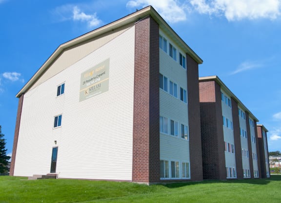 A white and red building with a sign that says "K-12 School".