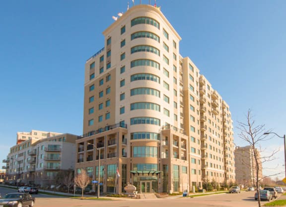 A large, modern building with a curved design and many windows.