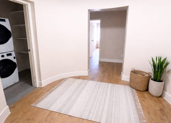 A laundry room with a washer and dryer in it.