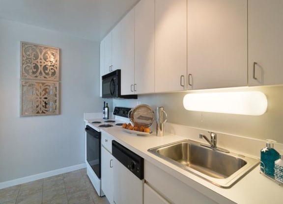 Bright kitchen with ample cabinets and pantry closet
