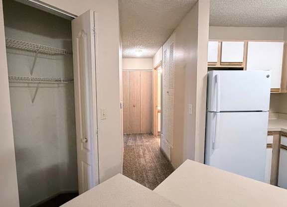 A white refrigerator is in the kitchen.