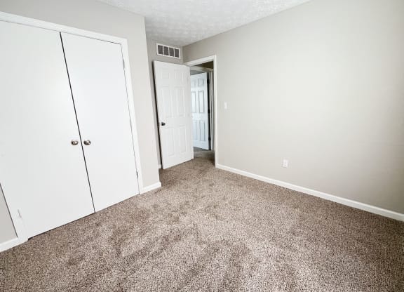 Bedroom with wooden floor at 450 on Keeneland Apartments, Kentucky