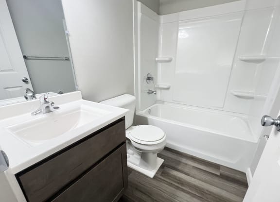 an empty bathroom with a sink toilet and shower at Fox Run Apartments, Cincinnati
