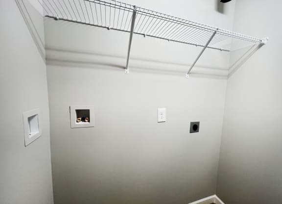 a room with white walls and a wire rack on the ceiling  at Brookfield Village Apartments, Ohio, 43123