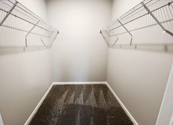 a spacious room with two closets and a carpeted floor  at Brookfield Village Apartments, Ohio