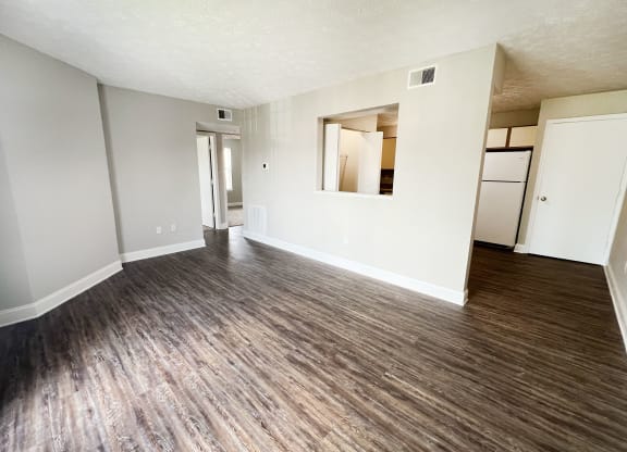 living room with white walls and wood flooring at 450 on Keeneland Apartments, Kentucky