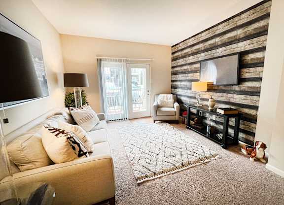the living room of a home with a couch and a tv at Liberty Crossing, Columbus, 43235