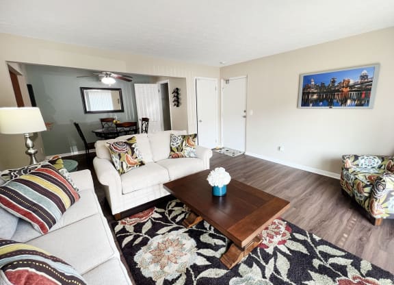 a living room with couches and a coffee table at Fox Run Apartments, Cincinnati