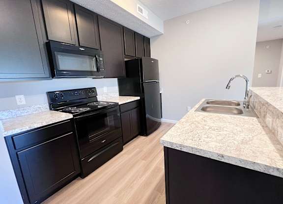 Kitchen with Cabinets at Hebron Station Apartments, Hebron