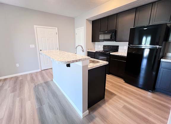 Kitchen with White Island at Hebron Station Apartments, Hebron, KY, 41048