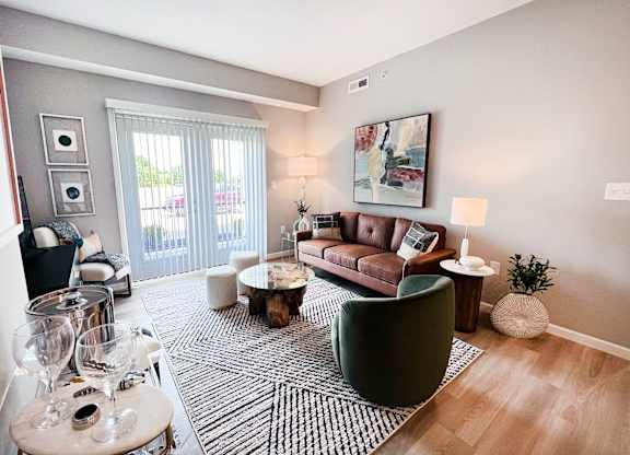 Living Room with a Brown Couch at Hebron Station Apartments, Hebron, KY