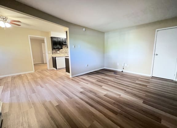 an empty living room with wood flooring at Hunter Ridge Apartments, Cincinnati