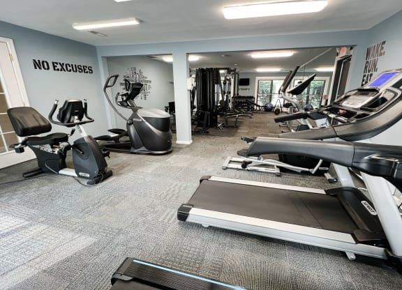 a gym with treadmills and other exercise equipment  at Deercross Apartments, Ohio