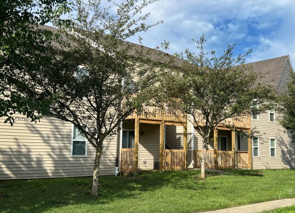 the exterior of a house with trees in front of it at 450 on Keeneland Apartments, Kentucky