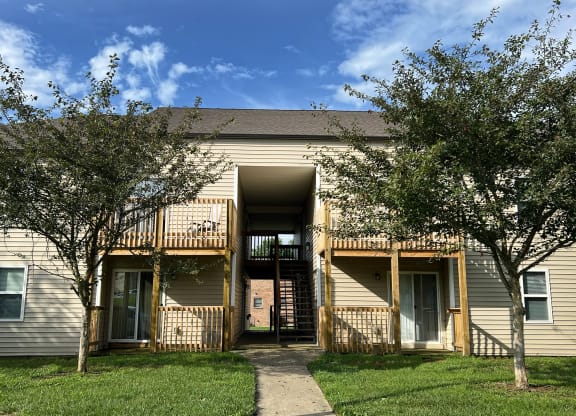 an apartment building with trees and a sidewalk at 450 on Keeneland Apartments, Richmond, 40475