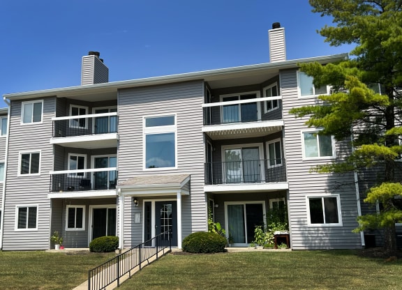 a large white house with a yard in front of it at Deercross Apartments, Cincinnati, OH