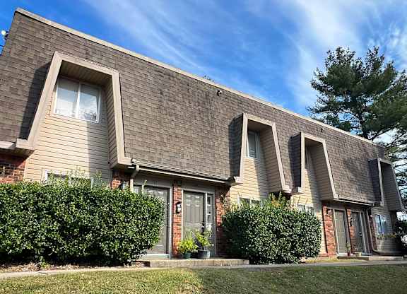 a house with three windows on the side of it