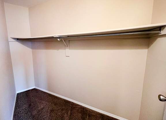 a walk in closet with a long horizontal bar on the wall at Indian Lookout Apartments, Cincinnati, OH, 45238