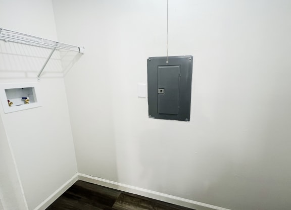 a black door on a white wall in a room at Deercross Apartments, Cincinnati