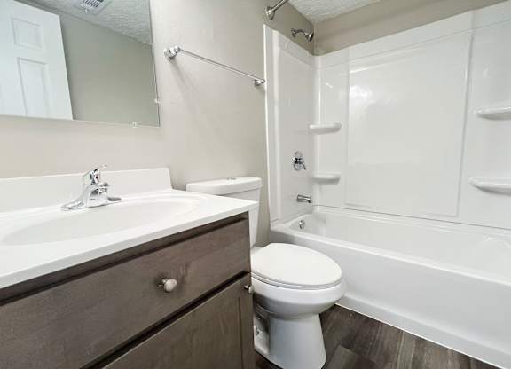 the preserve at ballantyne commons apartment bathroom with tub sink and toilet at Revere Village Apartments, Centerville, Ohio