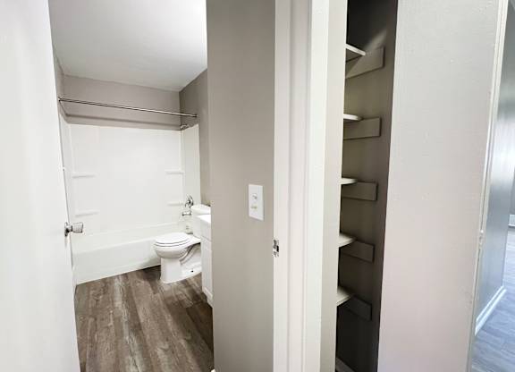 A small white bathroom with a toilet and a sink.
