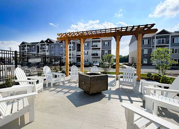 Outdoor courtyard seating area with wooden pergola at The Meridian on 32 Apartments, Batavia, Ohio