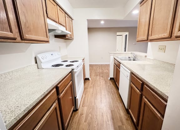 a kitchen with wood flooring and granite counter tops  at Deercross Apartments, Cincinnati, 45236