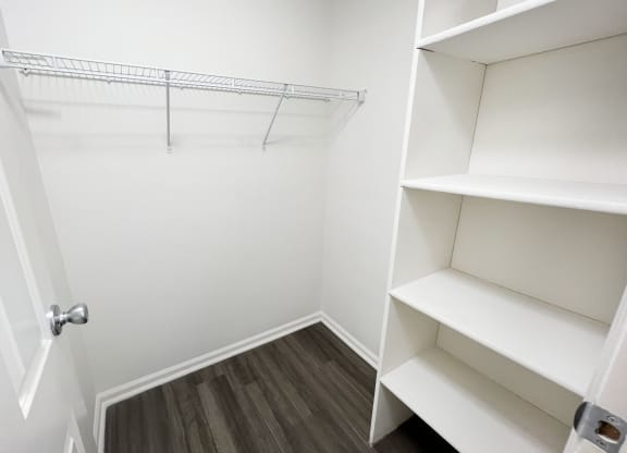 a closet in a small room with shelves and a door  at Deercross Apartments, Cincinnati, OH, 45236