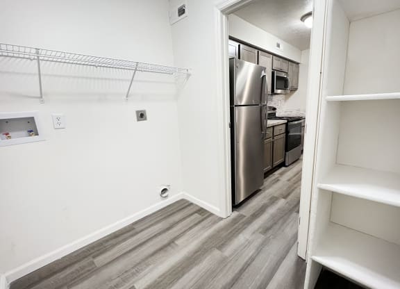 an empty kitchen with a stainless steel refrigerator and  at Deercross Apartments, Ohio