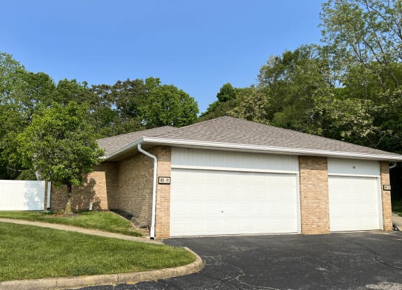 a home with a white garage door  at Wyndemere Apartments, Ohio, 45005