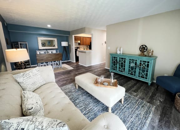 a living room with a couch and a chair  at Steeplechase Apartments, Loveland, Ohio