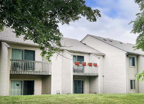 a white building with a gray roof  at Hunter's Creek Apartments, Cincinnati
