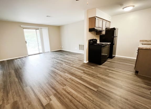 a kitchen and living room with hardwood floors at Crown Ridge Apartments, Franklin, 45005