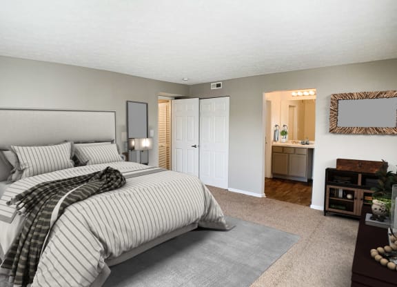 a bedroom with a bed and a bathroom with a sink at Knobs Pointe Apartments, New Albany, IN