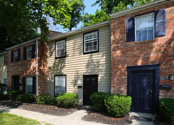 the front of a brick house with black doors at Walnut Creek Townhomes, Cincinnati