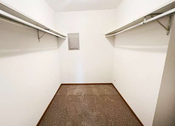 an empty room with two closets and a carpet at Forest Creek Apartments, OH 45044