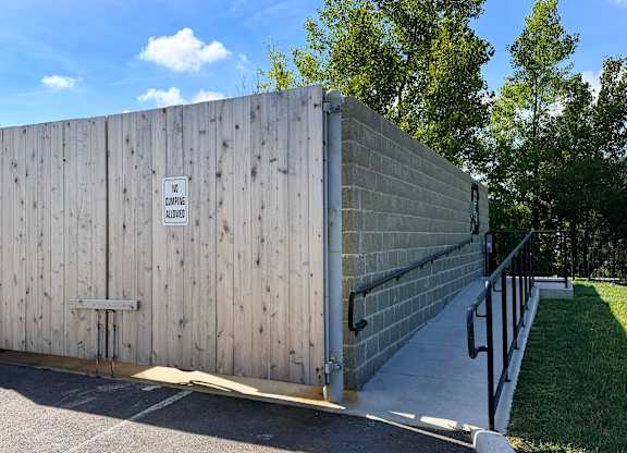 A wooden fence with a sign on it.