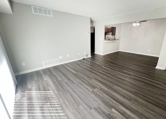 the living room of an empty apartment with wood flooring at Fox Run Apartments, Cincinnati, 45236