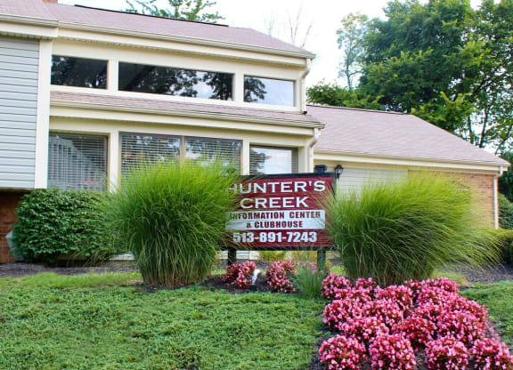 a yard with a sign in front of a house  at Hunter's Creek Apartments, Cincinnati, 45242