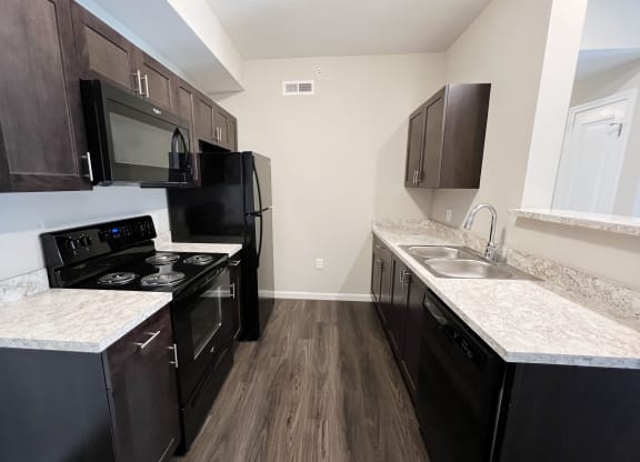 Kitchen with cabinets and counter table at Parkway Trails, Kentucky