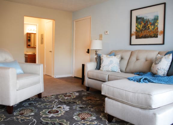 a living room with a couch and a chair  at Hunter's Creek Apartments, Cincinnati, OH, 45242