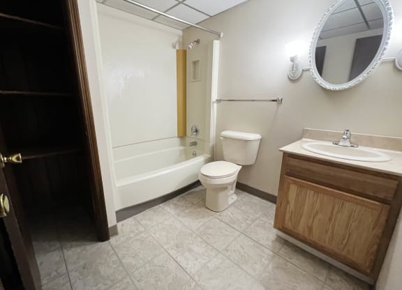a bathroom with a toilet and a sink and a bath tub  at Grace Court, Ft. Mitchell, KY