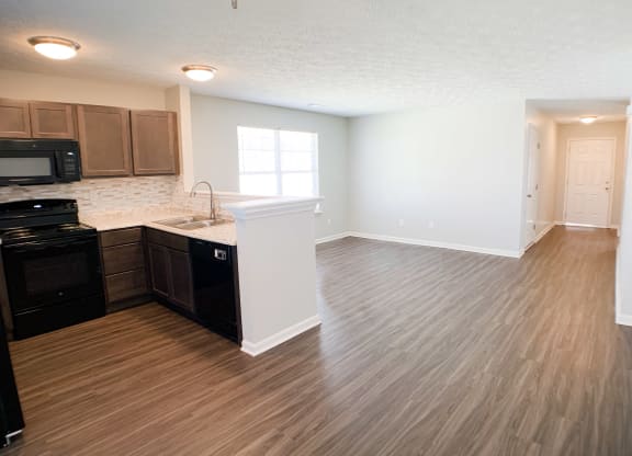 an empty kitchen and living room with wood flooring and  at Aberdine Place, Kentucky, 40324