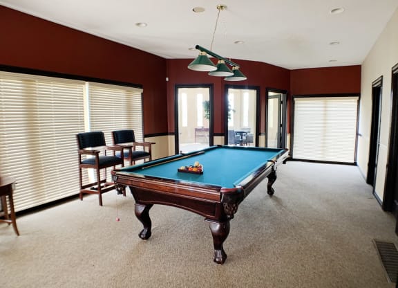 a pool table in the middle of a living room  at Knobs Pointe Apartments, New Albany, IN, 47150