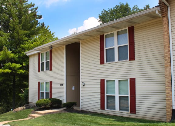 a white house with red shutters and a lawn  at Timber Ridge Apartments, Cincinnati, OH, 45241