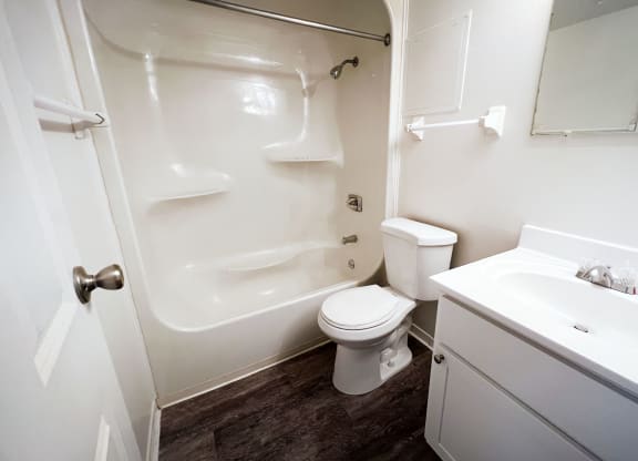 a bathroom with a white sink and toilet next to a white bathtub at Indian Lookout Apartments, Cincinnati