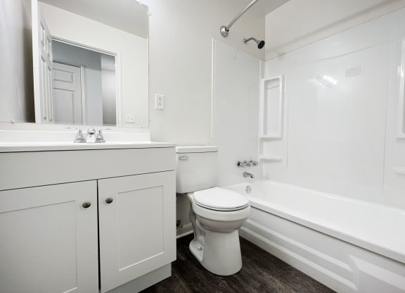 a bathroom with a toilet sink and bathtub at Wentworth Estates Apartments, Florence, KY