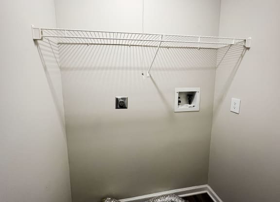 a closet in a bedroom with white walls and a white ceiling  at Woodhills Apartments, West Carrollton, OH, 45449