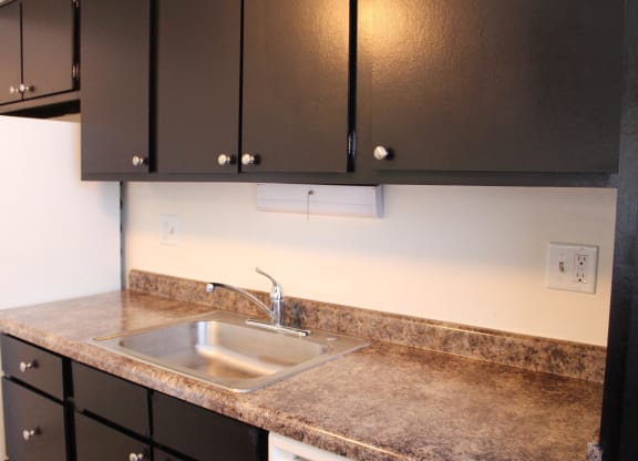 Dark wooden cabinets and counter table at Miamisburg by the Mall, Miamisburg, 45342